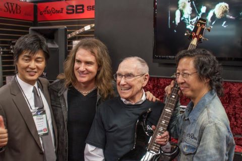 David Ellefson of Megadeth (2nd from left) and Ray Burton (2nd from right) at the ARIA Guitars booth at NAMM 2013. Photo credit: Metallica official Facebook.